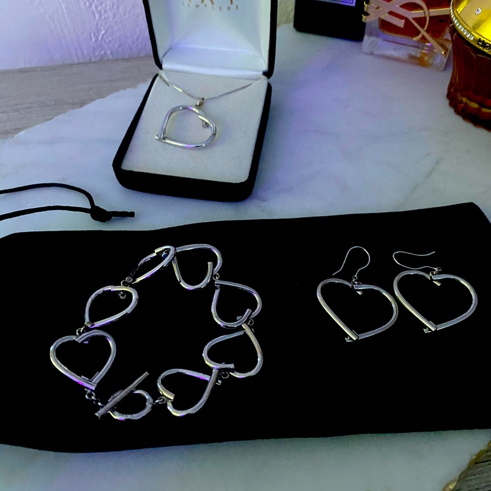 Beautiful 14kt White Gold set includes  earrings, necklace, bracelet
